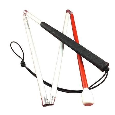 A folding white mobility cane with a black rubber grip, a red lower section, a white rolling tip and a black elastic loop, shown partly folded on a white background.